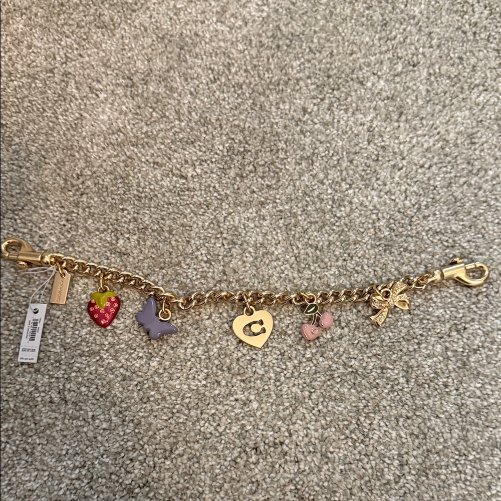 Gold Coach Purse Charm with Heart and Butterfly Accents